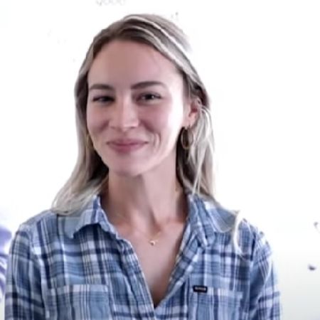 Bryanna Holly is smiling at the camera.